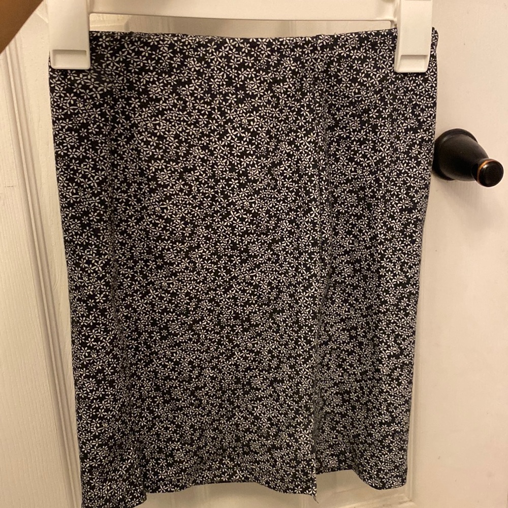 This is a navy blue skirt with little flowers on it.